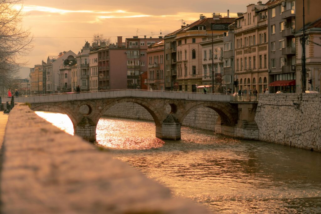 Beautiful sunset view of the historic Latin Bridge over Miljacka River in Sarajevo, Bosnia.