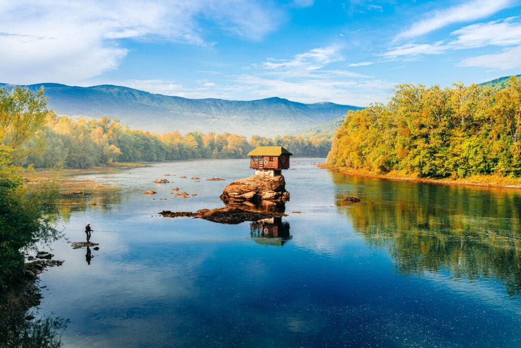 pexels-photo-35873260-35873260 Scenic view of a small house perched on a rock in the Drina River, Mokra Gora, Serbia.