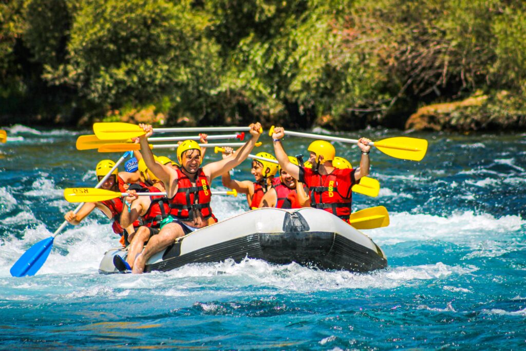 pexels-photo-11183386-11183386 Group of friends enjoying an exhilarating river rafting adventure outdoors.